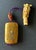 A Japanese four-case inro stringed together with a silk cord of a carved wood Ojime and a carved ivory netsuke circa 19th...