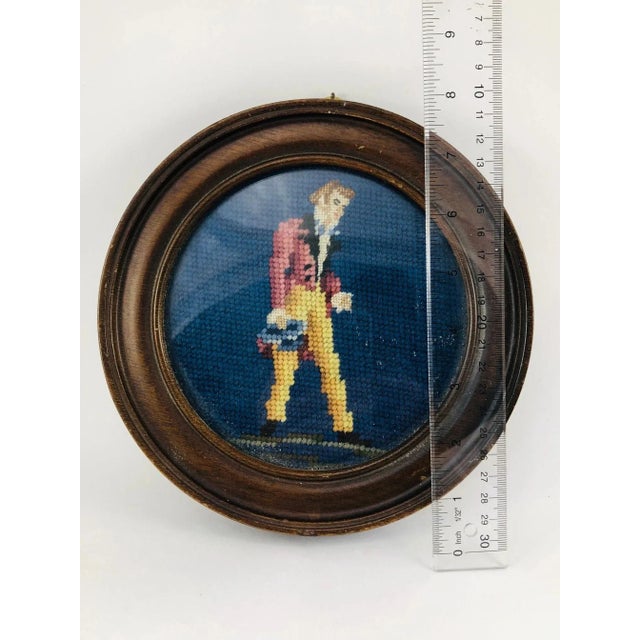 This beautifully rendered late 19th century needlepoint piece depicts a rather distinguished gentlemen appearing to be on...