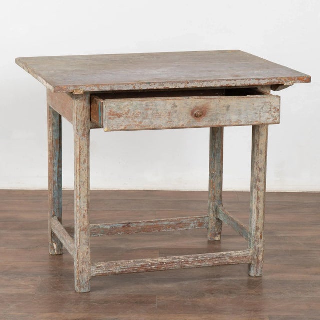 Swedish country original painted pine side table with single drawer. The original antique gray paint has been worn down to...