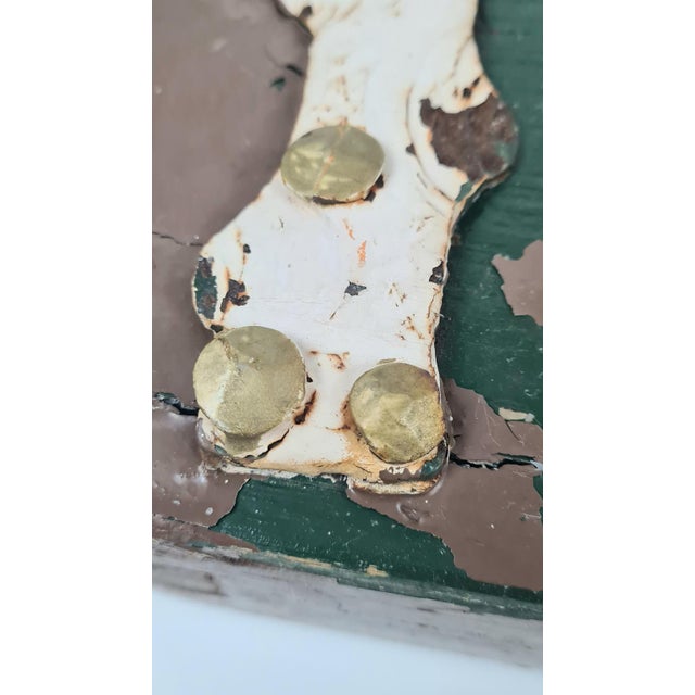 An original antique wooden pediment (architectural finial) with a carved lion motif in a wreath. It is an authentic...