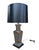 A striking Chinoiserie table lamp with a square, tapered vase-form body in a brushed pewter finish, decorated with applied...