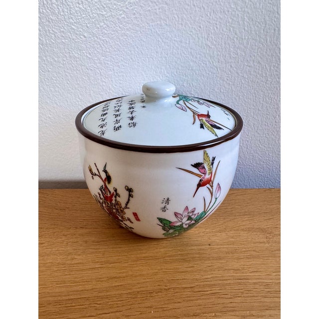 Vintage Chinese porcelain container with delicate hand-painted birds and calligraphy — authentic decorative jar,...