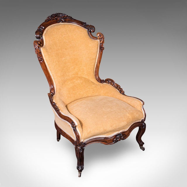 This is an antique colonel's salon chair and stool. An English, rosewood and brushed cotton parlour seat, dating to the...