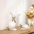 Add a sweet and polished touch to your decor with this set of rabbit figures, featuring a smooth glossy white finish...