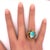 A captivating cocktail ring featuring a mesmerizing opal with a multi-colored hue. The opal is set in a bold, organic...