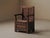 Rare 19th-century solid wood armchair from the Cantal, featuring a built-in storage chest beneath the seat. The paneled...