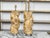A pair of Italian twisted column wooden fragments from the 18th century, with carved giltwood grapevine motifs and round...