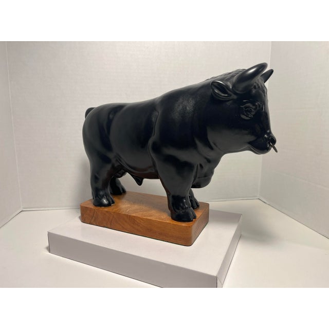 Vintage Ceramic Black Bull Figurine with Wooden Base Aprox. dimensions: 13"W x 10"H x 4"W Good vintage condition!