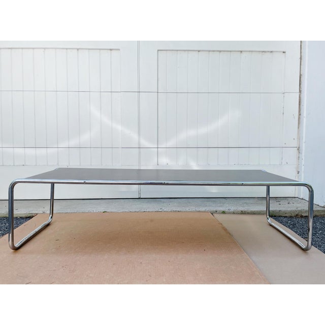 This 20th Century coffee table was designed in the style of the Knoll Laccio coffee table by Marcel Breuer. Breuer's use...