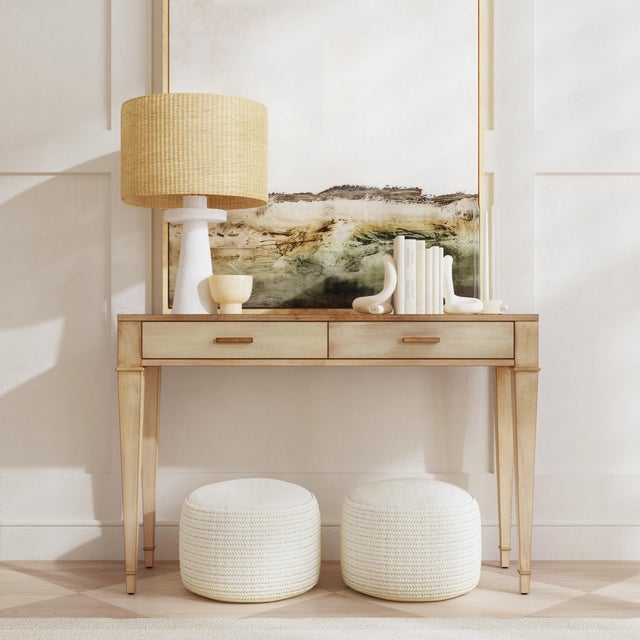 Indulge in timeless elegance with the Kai 2-drawer console table. Crafted in a serene taupe finish, its antiqued detailing...