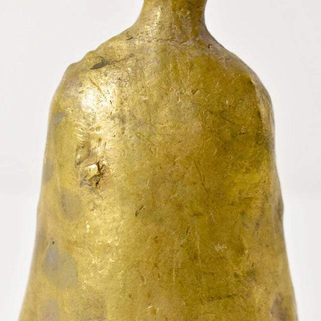 The brass metal bell was crafted by the Benue and Chamba artisans and metalworkers of Nigeria. These bells were often used...