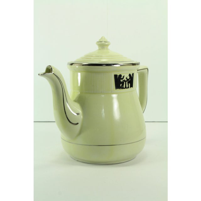 An interesting large porcelain coffee pot Very collectible, part of the Silhouette pattern series of early Hall China...