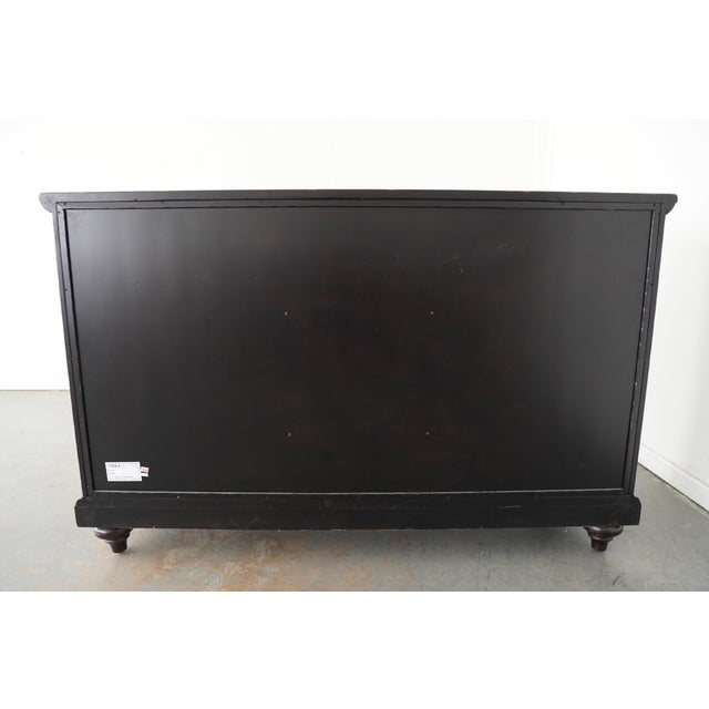 Hammered copper adds a warm glow on the serving surface providing a perfect counterpoint to the aged bronze hardware....