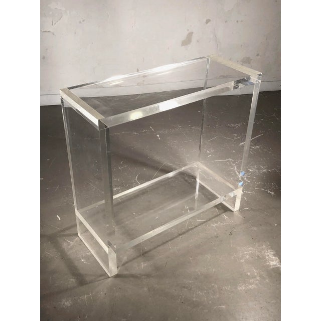A rigorous rectangular console, post-modernist, space-age, seventies, shabby-chic, geometric structure solidified by a low...