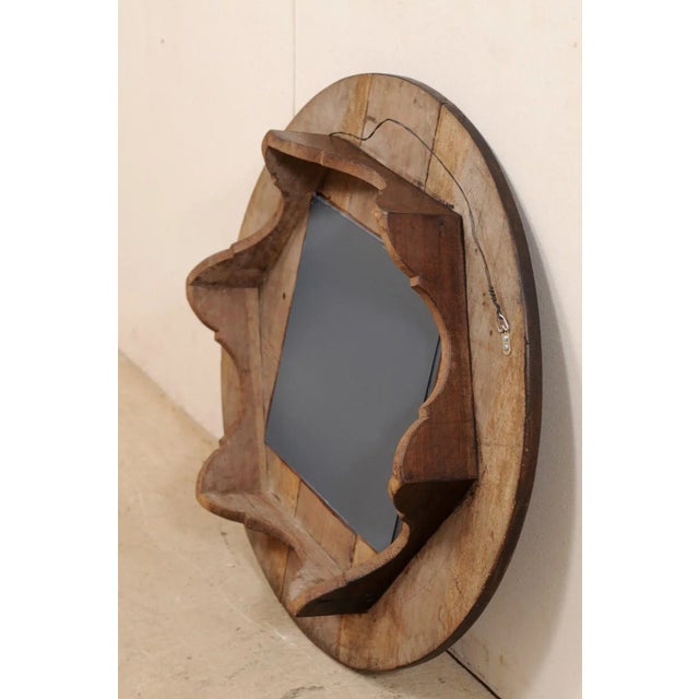 This custom mirror has been creatively up-cycled with an old N. African wooden cooking utensil as the surround, with new...