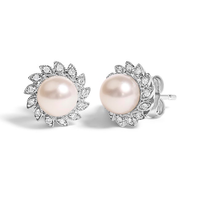 Immerse yourself in the timeless elegance of these exquisite stud earrings, masterfully crafted from radiant 10K white...
