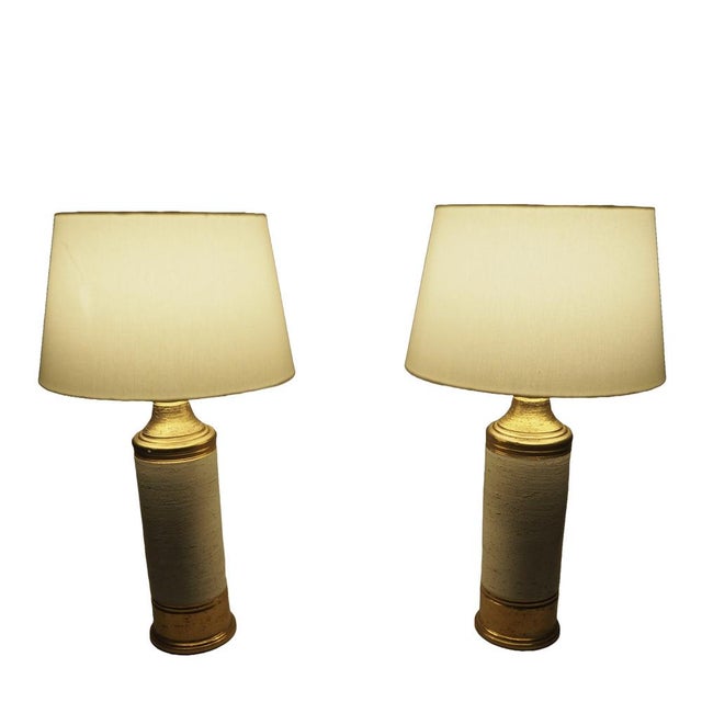 Rare Pair of Sculptural Cream and Gold Ceramic Table Lamps by Bitossi for Bergboms, Italy, 1960s A striking pair of...