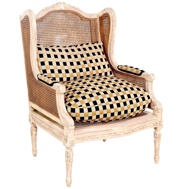 Vintage pair of Louis XV wingback double caned bergeres crafted sometime in the late 20th century. Structurally sound -...