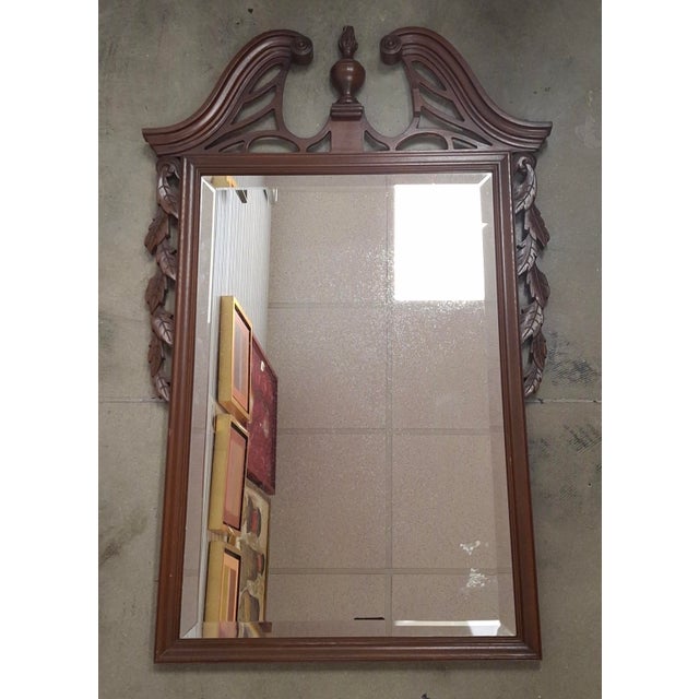 Mid 20th Century Georgian Style Carved Mahogany Framed Beveled Mirror Measures 22" in width and 34.25" in height.