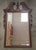 Mid 20th Century Georgian Style Carved Mahogany Framed Beveled Mirror Measures 22" in width and 34.25" in height.