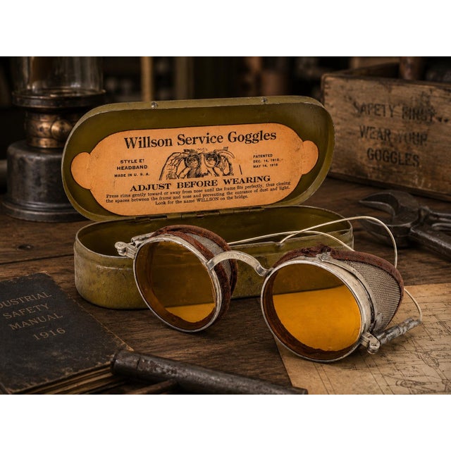 An authentic pair of early 20th-century Willson Service Goggles, Style E, presented with its original metal storage case....