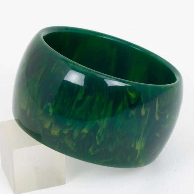 This gorgeous massive blue-moon marble Bakelite bracelet bangle features a chunky wide domed shape with an intense blue...