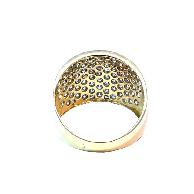 Elevate your elegance with this stunning cluster band ring, featuring a luxurious 14k yellow gold band that beautifully...