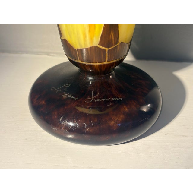 Beautiful decorative glass vase. Yellow with acid cut brown cameo overlay. Made around 1920s. Looks very elegant in any...