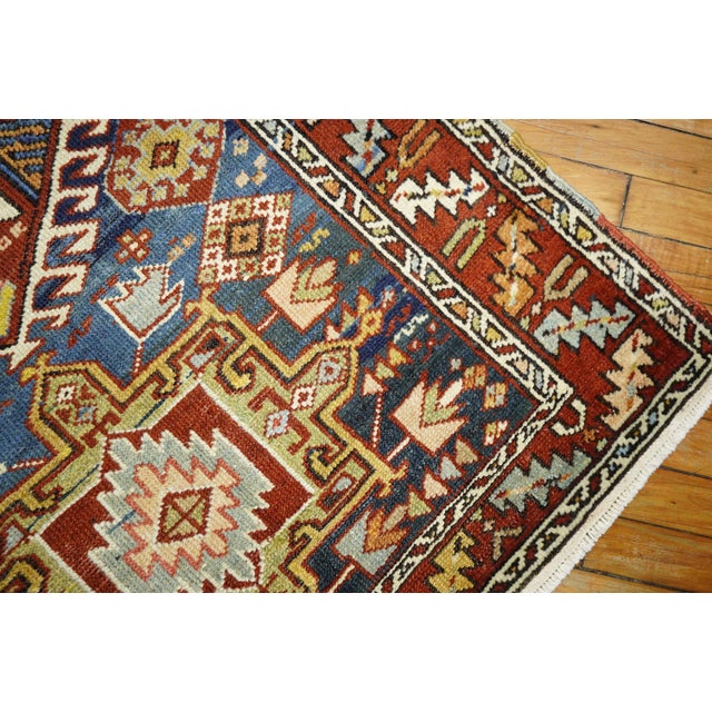 Antique Persian Heriz rug with a geometric motif on a navy blue ground. Great condition and quality. If you appreciate and...