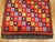 Bright colors highlight this mid-20th century intage Turkish Tulu rug. 4' x 4'11''