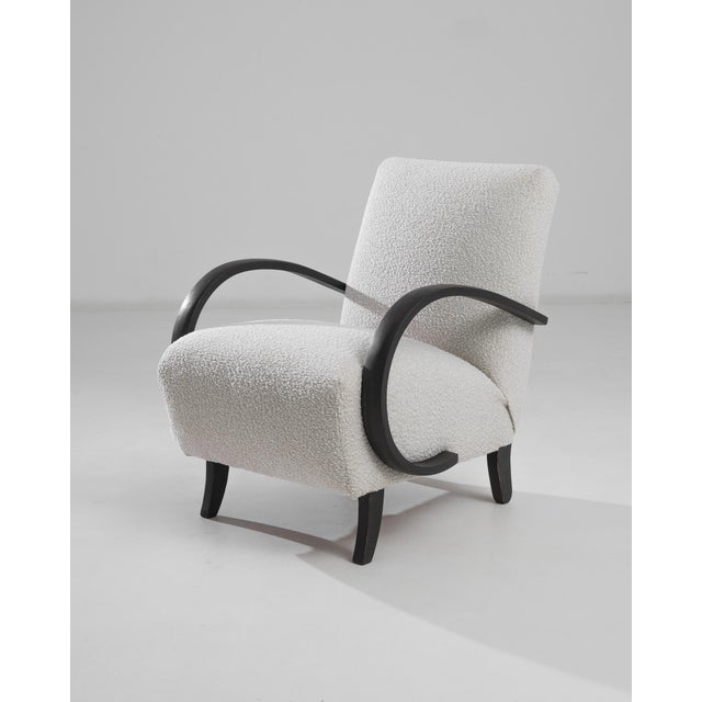 This 1930s Czech Wooden Armchair by J. Halabala is a striking example of early 20th-century modernist design, blending...