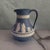 Lovely and graceful small jug or pitcher from Wedgwood. Classic blue and cream Jasperware. Feautres neoclassical mythology...
