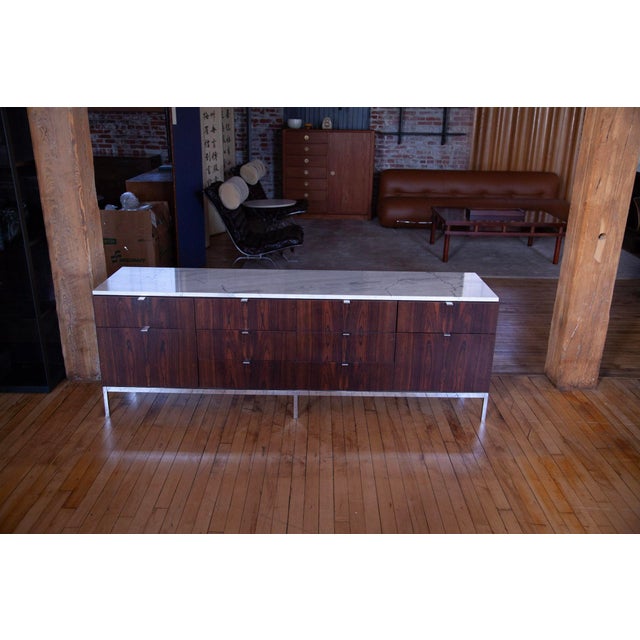 This is a rare Knoll rosewood and marble credenza, model 2544, first designed by Florence Knoll in 1961 as part of her new...
