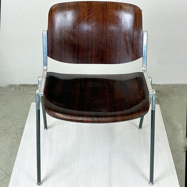 This iconic Italian Midcentury Modern DSC 106 stacking chair was designed 1965 by Giancarlo Piretti for Castelli Italy. It...