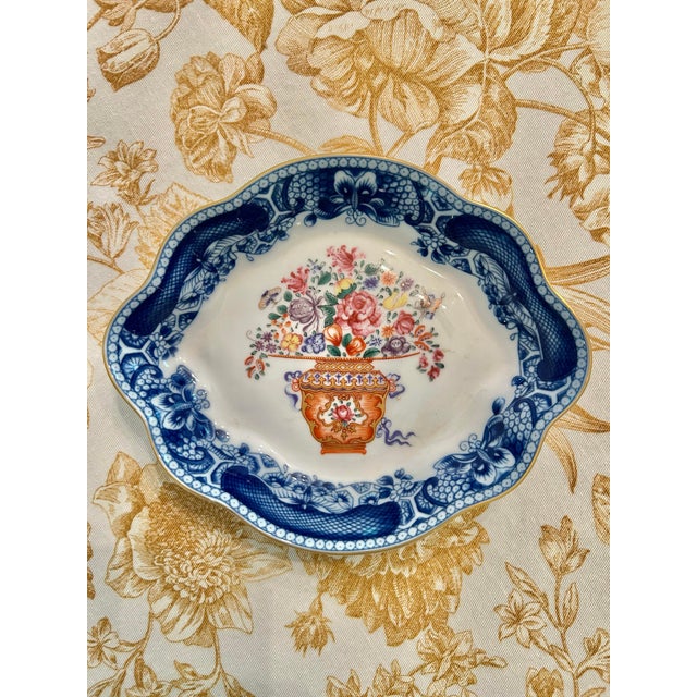 Referred to as a lobed tray, this piece would serve well in a vanity or entry table as a trinket dish. The dish is from...