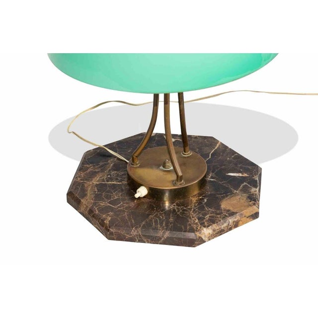 Vintage table lamp is an original design lamp item realized in the mid-20th Century. This lamp has a precious marble base...