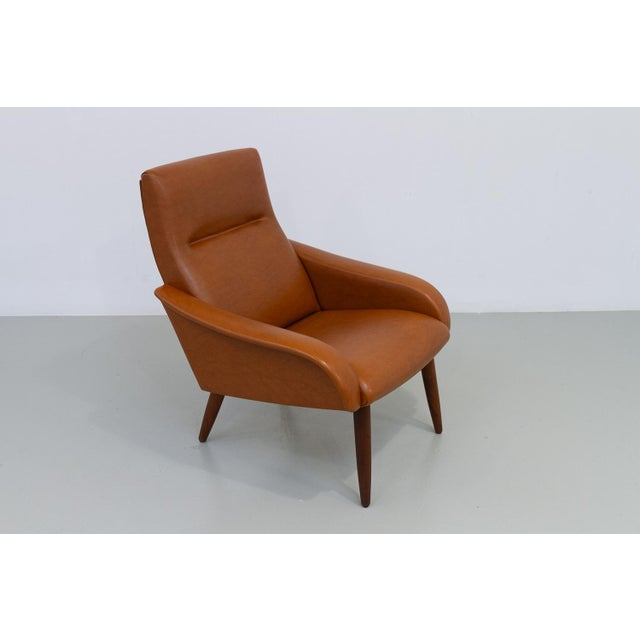 Danish Modern Lounge Chair by Globe, 1960s. Scandinavian Mid-Century Modern lounge chair in light brown faux...