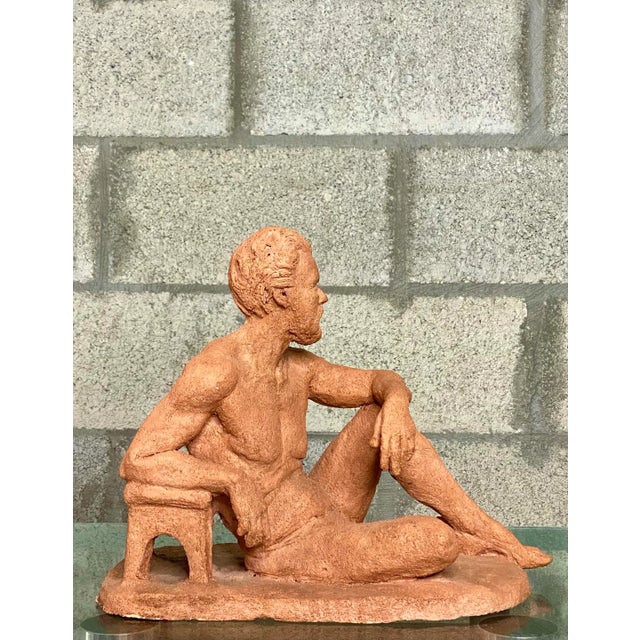 A fantastic vintage signed figure sculpture depicting a contemplative bearded man in a relaxed seated pose. Crafted in...