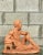 A fantastic vintage signed figure sculpture depicting a contemplative bearded man in a relaxed seated pose. Crafted in...