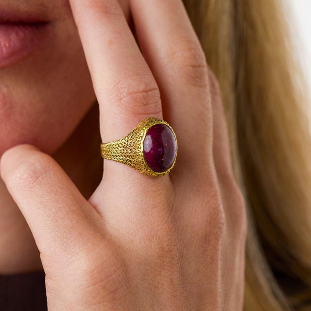 This striking Retro pink tourmaline ring is a beautifully expressive jewel from the 1940’s, centered by a cabochon cut...