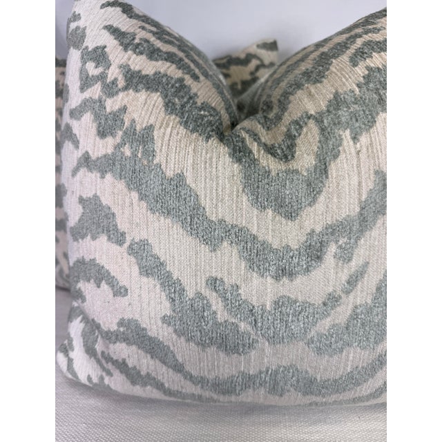 Custom pair of 22" pillows covered in an aqua/green tiger print chenille fabric. These pillows have tapered corners to...