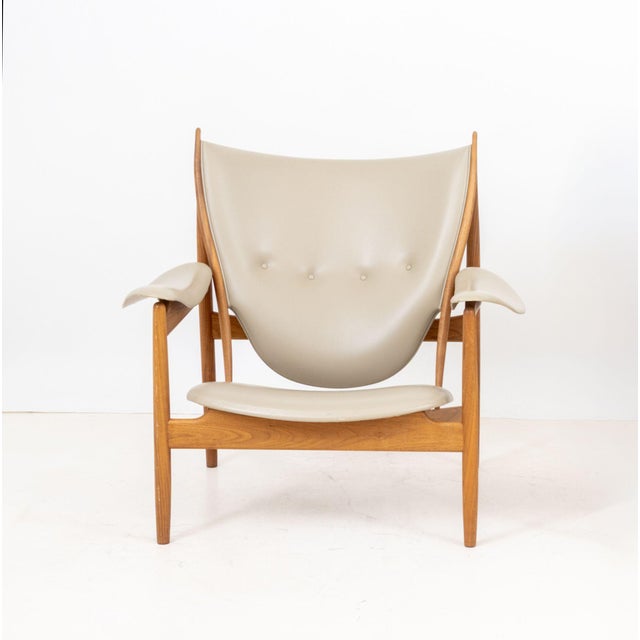 Finn Juhl (Danish, 1912-1989) "Chieftain" Lounge Chair, walnut frame and tan leather upholstery, with "One Collection /...