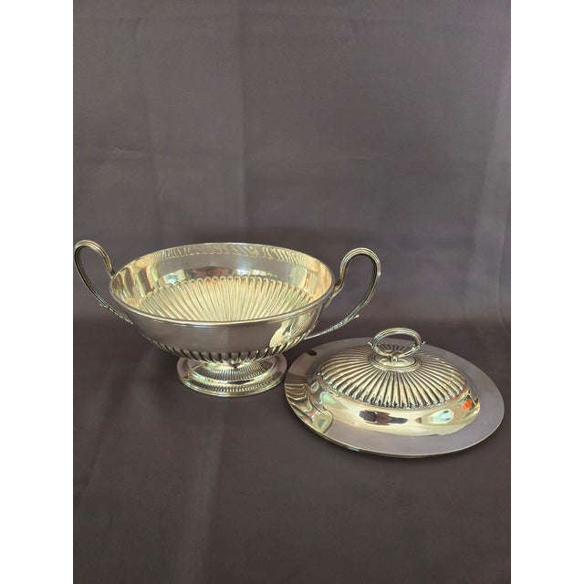 This is an exquisite silver plated sour Taureen with a distinctive fluted design on the lid and the bowl. This is in the...