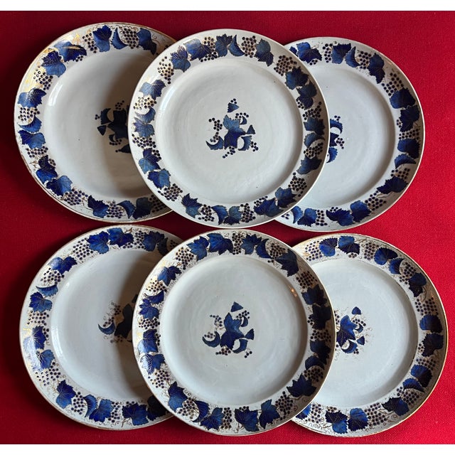 Set of six Chinese export porcelain blue and white plates. Each decorated in underglaze blue having a central floral spray...