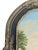 A charming vintage folk art landscape painting on board depicting a tranquil lake nestled among rolling mountains, lush...