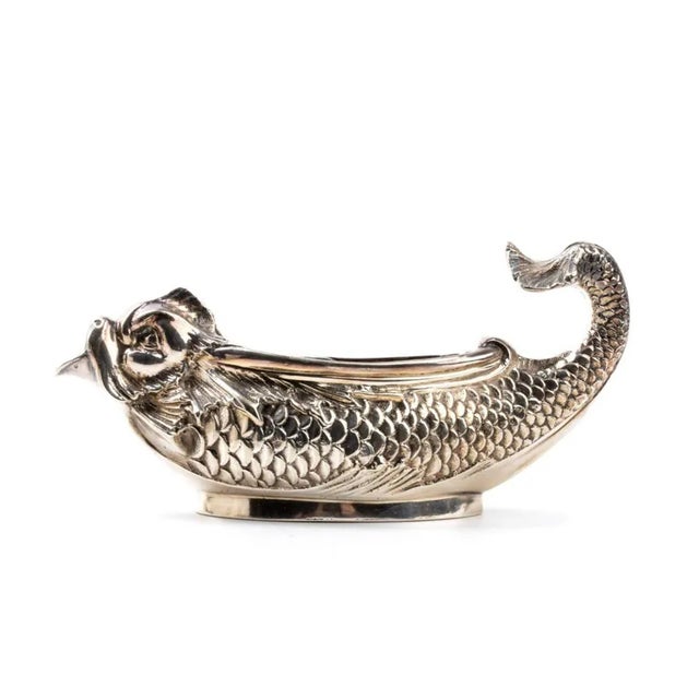 An exquisite milk jug from the famous jewelry house tiffany & co., made in the form of a fish with an elegant handle...
