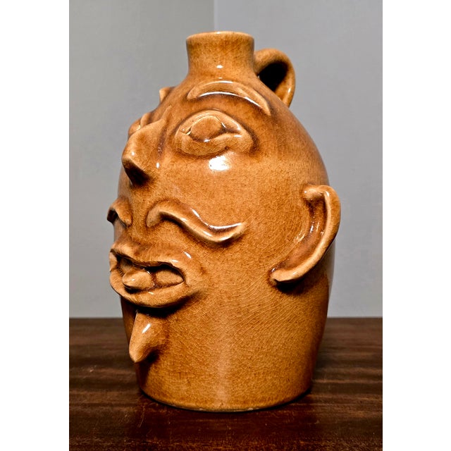 Bring a piece of authentic Southern Appalachian craft tradition into your collection with this captivating hand-thrown...