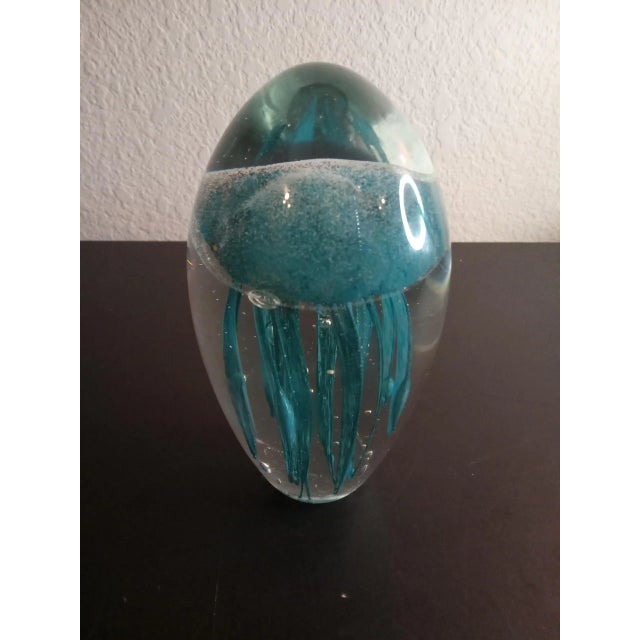 This is Clear Glass Blue Jellyfish 5" Oval Paperweight. Procured at auction