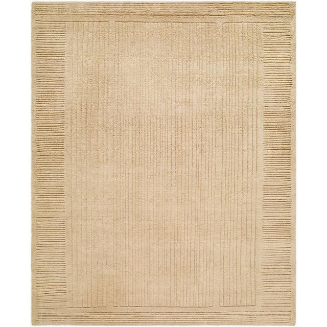 Introducing the Achro Collection's exquisite handmade rug, a perfect blend of timeless elegance and cozy charm that will...