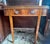 Swivel folding top accent card table. Mahogany veneer with attractive striped grain top. Round corners and waterfall...